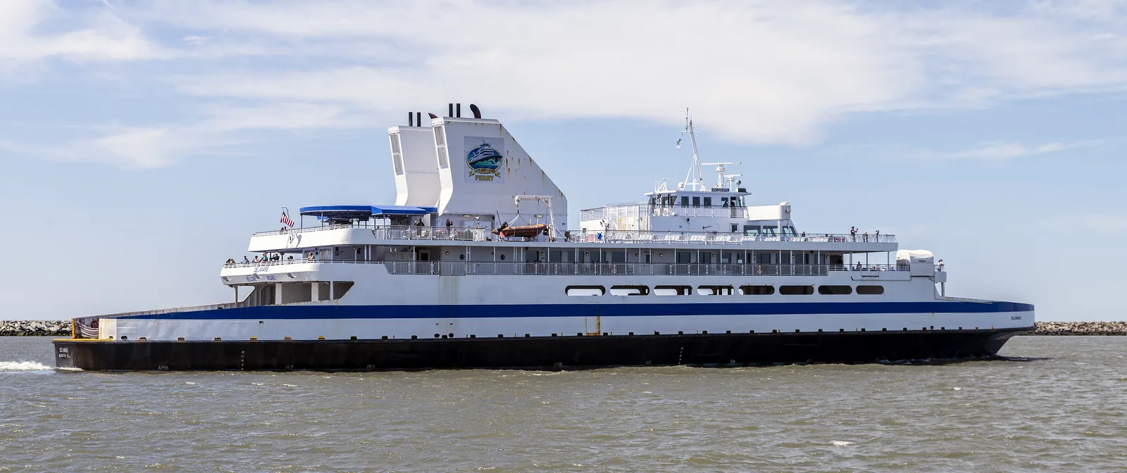 The Cape May-Lewes Ferry vessel MV Delaware under way off Lewes, Delaware, with the stone breakwater behind her.